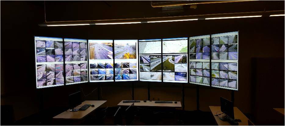 multiple monitors showing traffic scenes