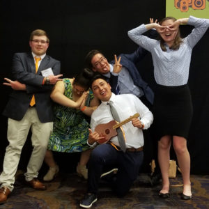 Students make silly faces at the awards banquet