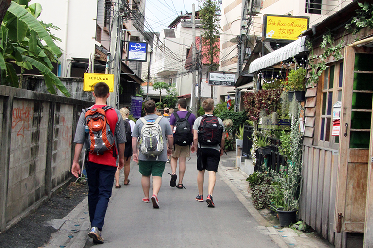 Group walking on Tha Pae Street