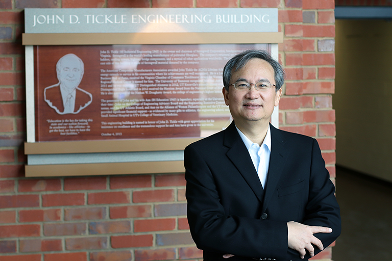 Joshua Fu stands in a hall of the Tickle Engineering Building.