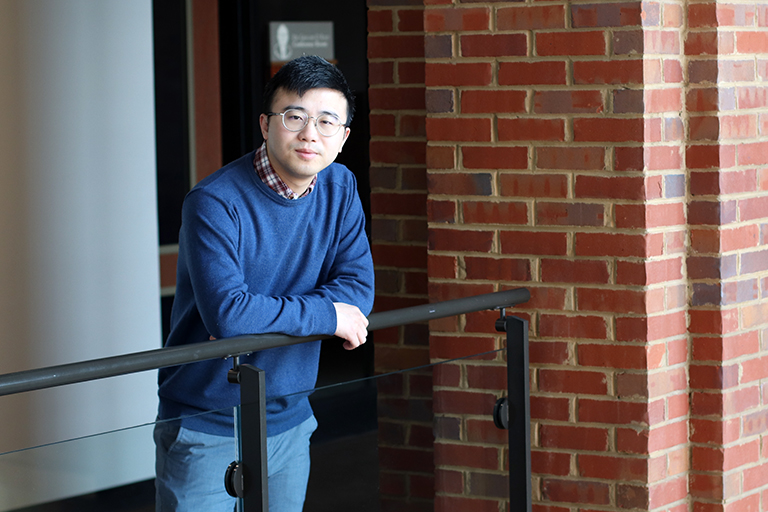 Shuai Li stands in a hallway of the Tickle Engineering Building.