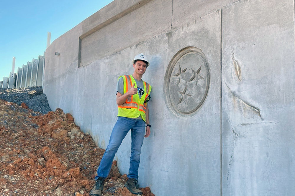 Charles Blalock stands next to a bridge that was recently constructed as part of the Alcoa Highway Expansion.
