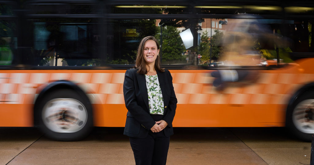 Candace Brakewood in front of UT bus