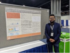 Sameer Aryal, a PhD student in civil and environmental engineering, standing with his poster at the transportation research board conference