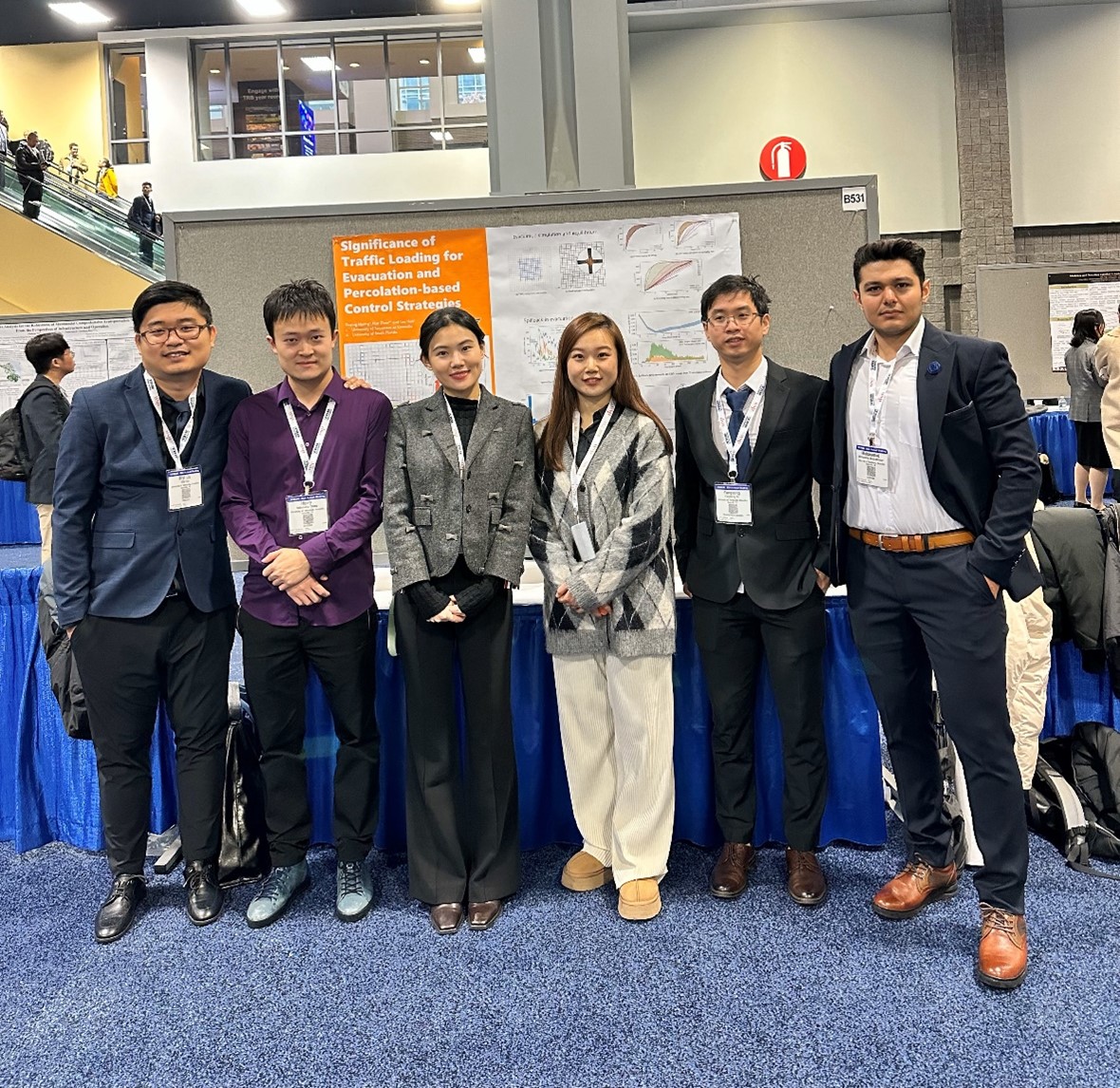 From left to right, Diyi Liu, Hairuilong Zhang, Ruqing Huang, Jinmu Lv, Yangsong Gu, and Mohammad Khojastehpour presenting their research at the 103rd Transportation Research Board Annual Meeting