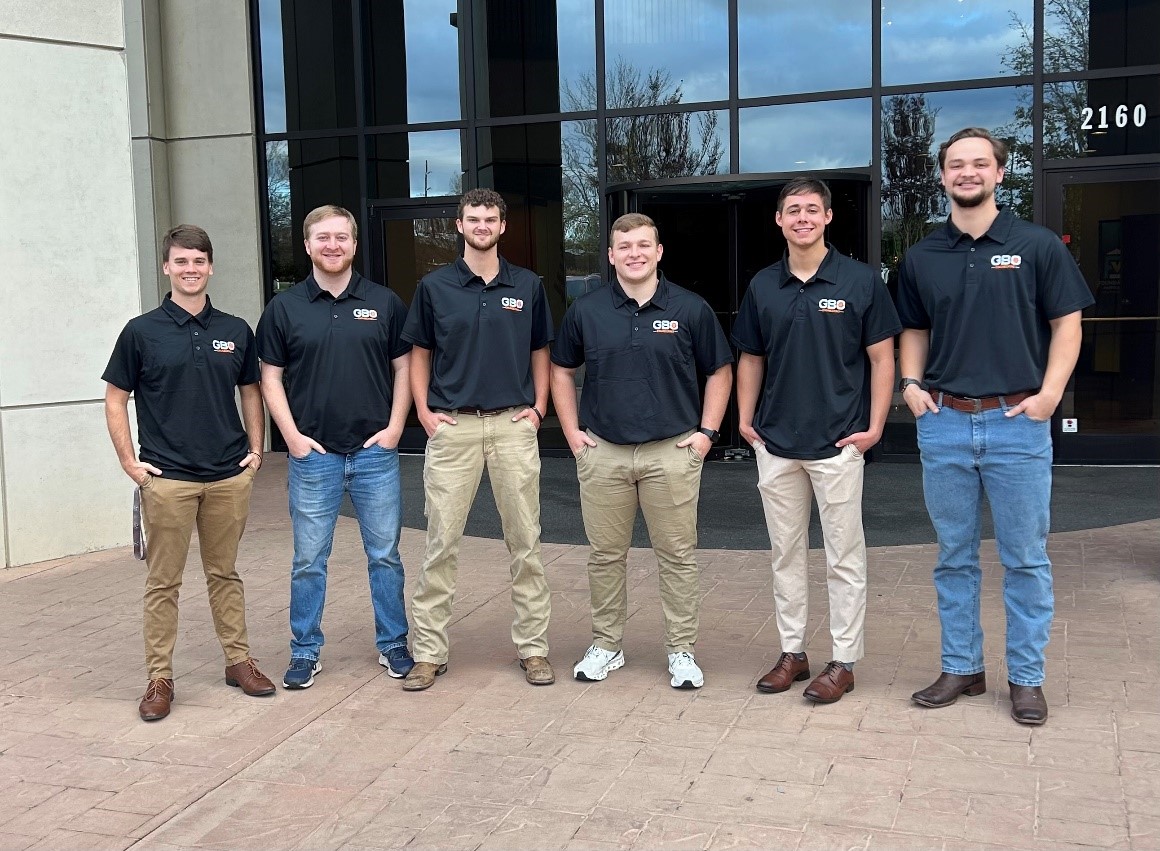 student team standing in front of the Tickle Building