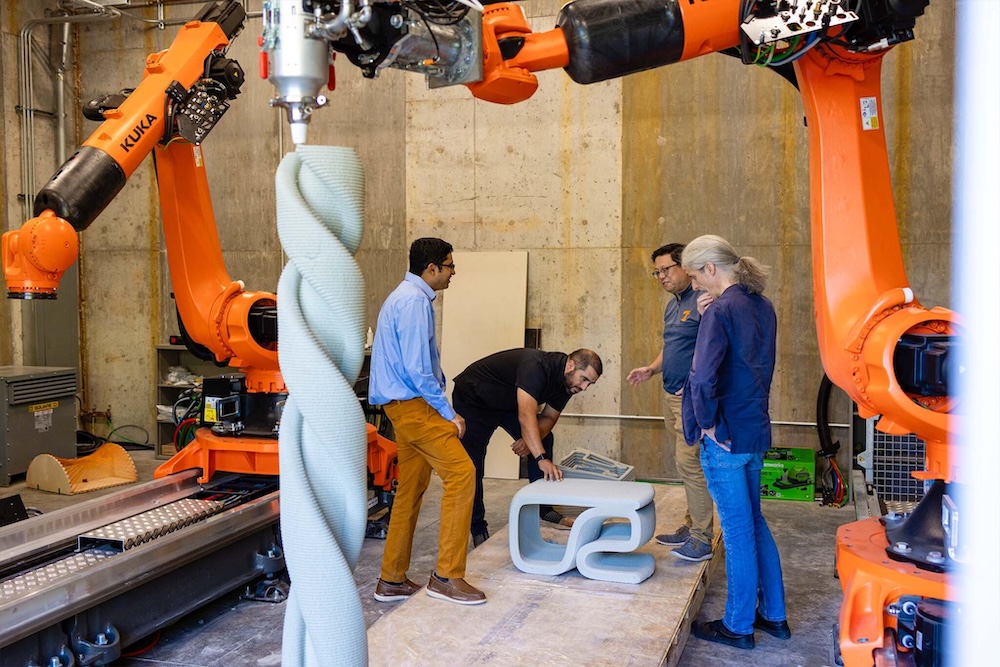 FCI team looks over a 3D printed item